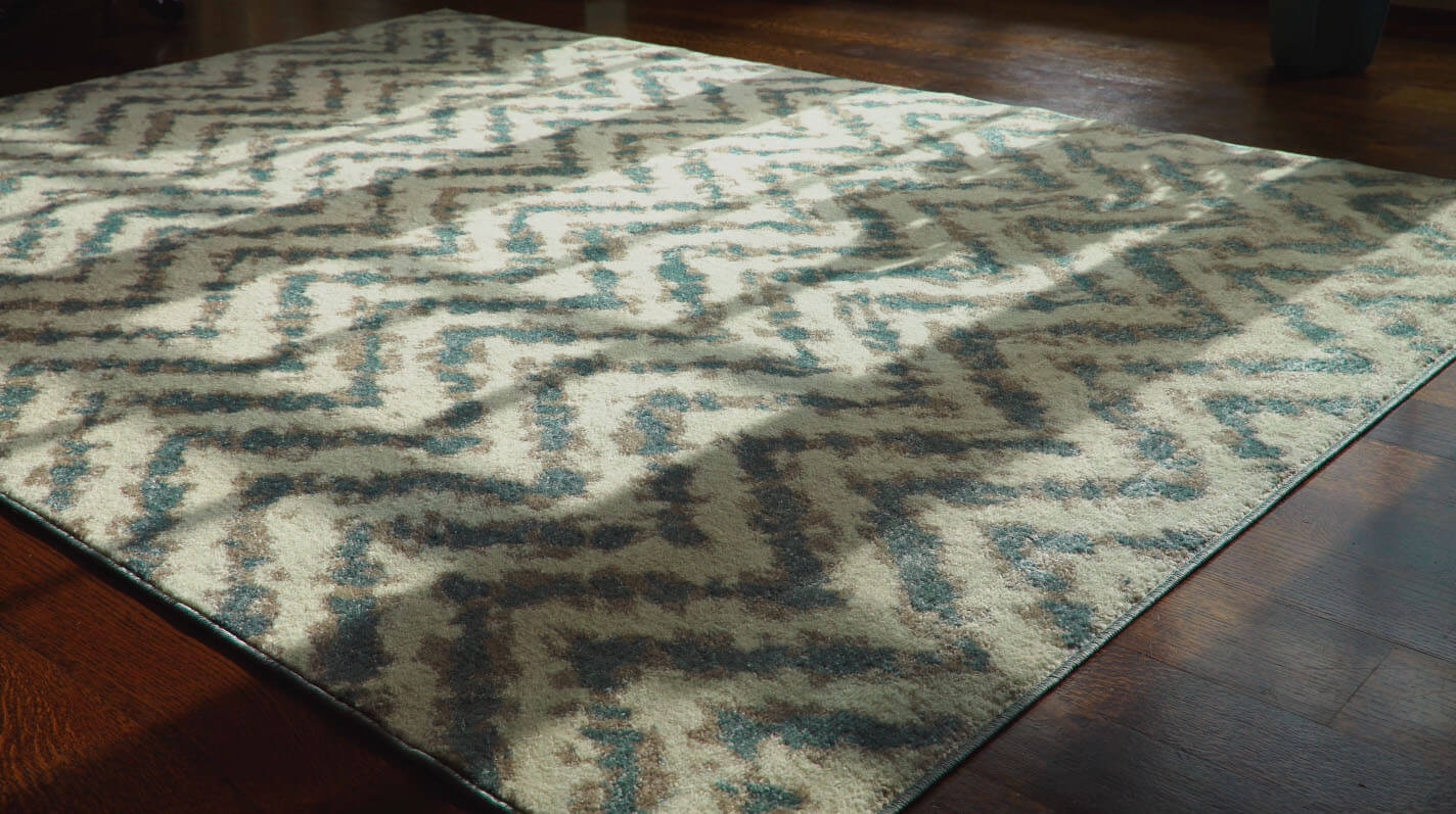 Clean area rug sitting on a hardwood floor. 
