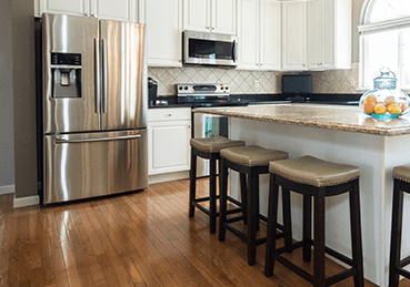 Open kitchen with hardwood floors