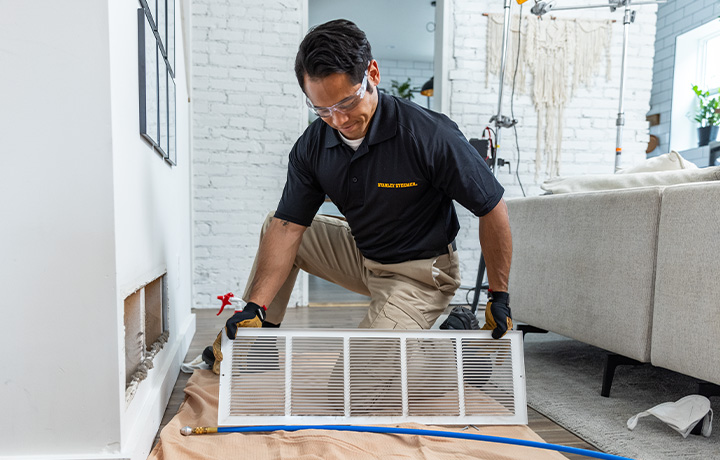 Stanley Steemer Technician Inspecting Air Ducts in Tacoma, WA