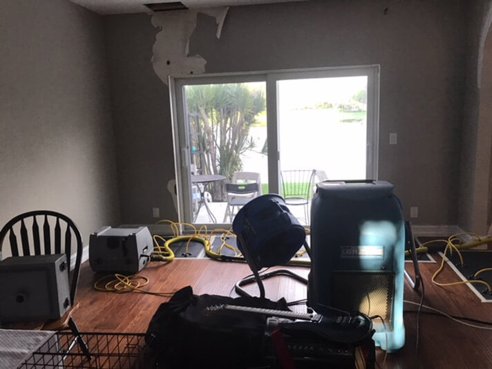 Water damage restoration equipment set up in a customer's home in Delray Beach, Florida.