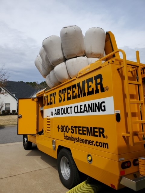 Stanley Steemer Air Duct Cleaning Truck With Collection Bags Deployed in Little Rock, AR Neighborhood