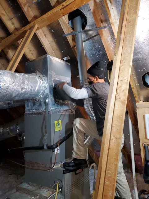 Stanley Steemer Technician Preparing Furnace for Air Duct Cleaning in Little Rock, AR Home