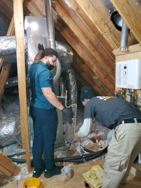 Stanley Steemer Technicians Preparing HVAC System for Air Duct Cleaning in Little Rock, AR Home