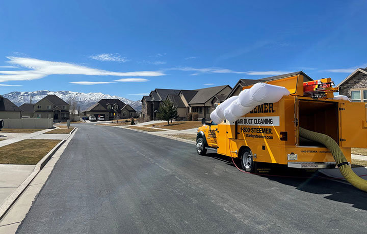 Stanley Steemer Air Duct Cleaning Truck Parked in Salt Lake City, UT Neighborhood