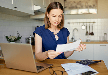 Woman looking over carpet cleaning prices and offers